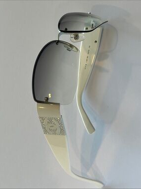 CHANEL Ivory Temples with Gray Gradient Rimless Sunglasses.